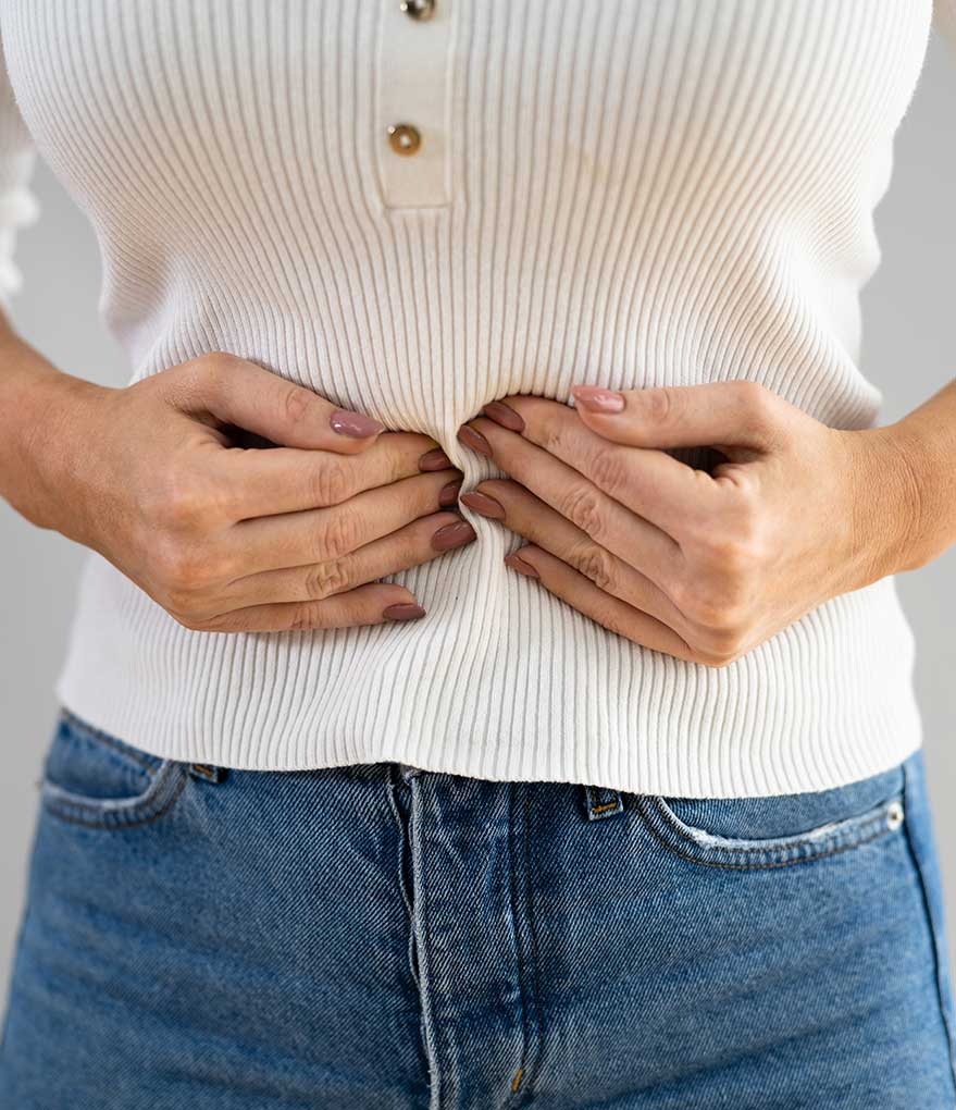 IBS Mastery Course - woman holding stomach