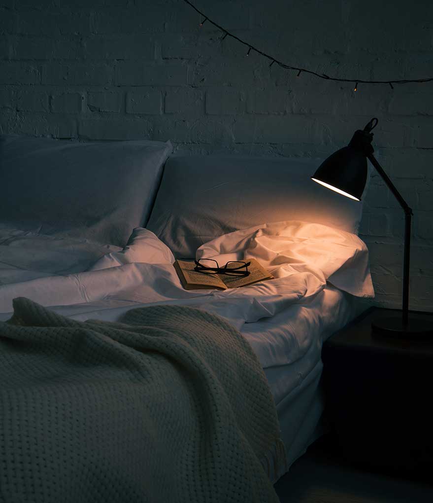 Sleep Wellness: Mastering the art of more restful sleep - image of bed at night